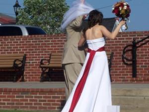 wedding dress with red sash